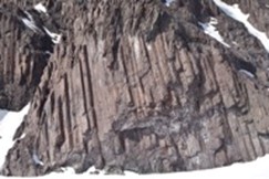 Image of columnar jointed Cretaceous arc volcanic rocks