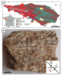 Figure 1a shows a geological map of the Armorican domain in Brittany, northwest France. The South Armorican Shear Zone cuts through the centre of the domain, running roughly east-southeast to west-southwest. (b) shows a 10x10 cm sample of pale brown orthogneiss with roughly horizontal S-C fabrics. It was collected from a region south of the shear zone, in roughly the centre of the map shown in (a).