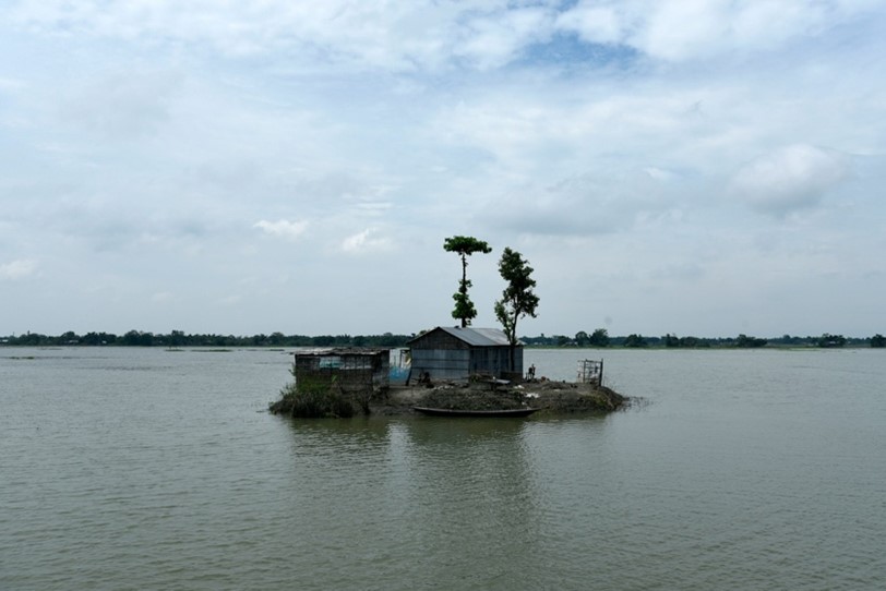 A house is cut off by floodwater, Barpeta, India.