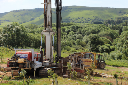 Image shows a large vertical drilling machine excavating a former landfill site. Its use demonstrates the size and scale of the proposed project.