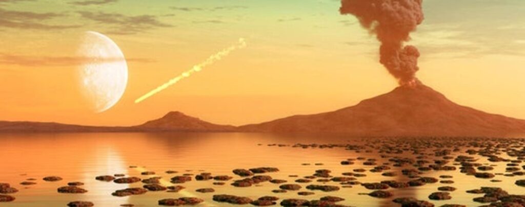 An artist’s impression of the early Earth’s environment. The foreground depicts a shallow marine environment with stromatolites visible above ocean level to the right of the image. The marine environment is overlooked by erupting volcanoes in the background. The larger of the two volcanoes (which is on the right of the image) has a plume of smoke and ash emanating from the summit. A white streak of gas indicating a meteorite trail is found in the central left of the image. Further towards the left, a bright grey half-moon is also shown in the background.